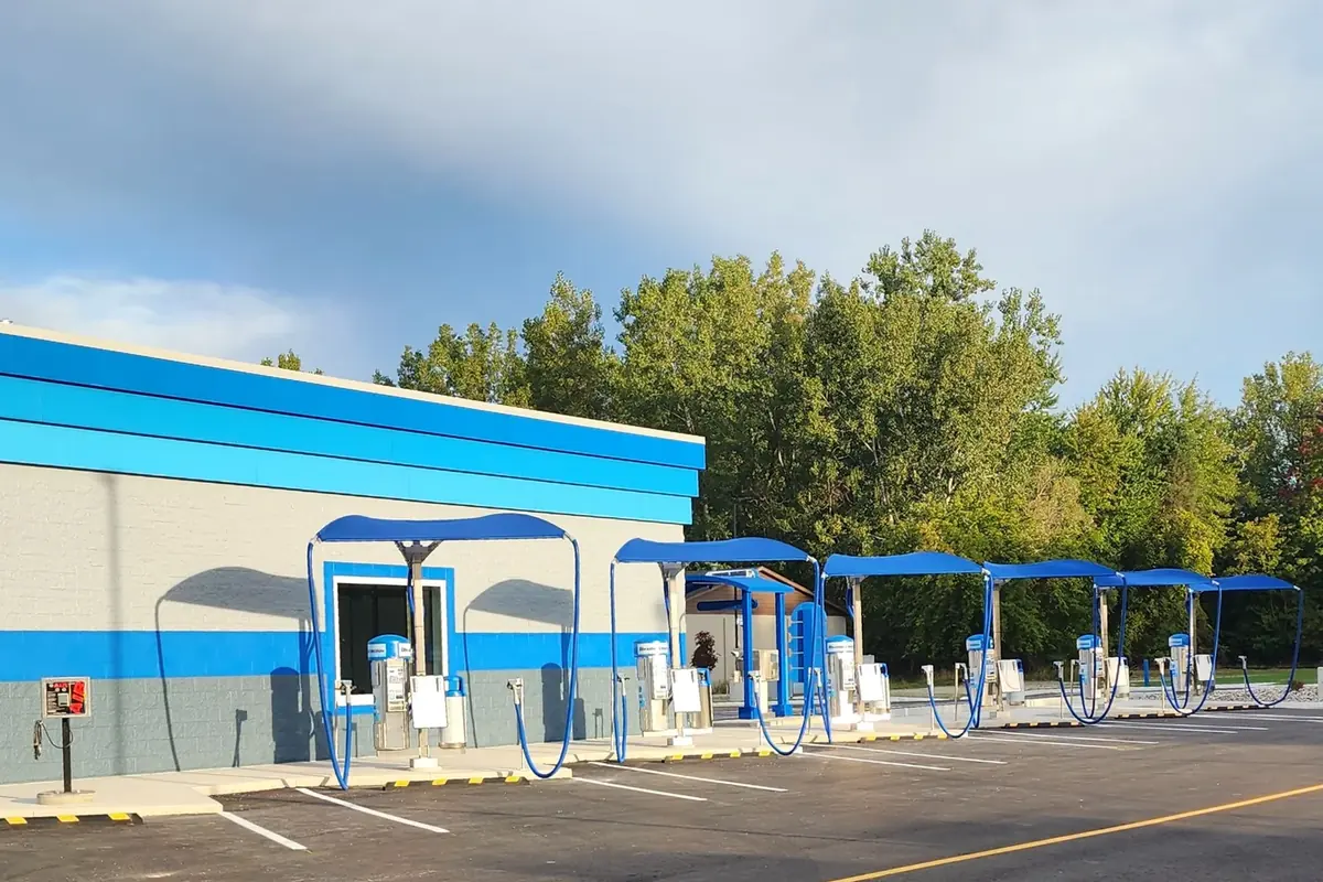 Row of free vacuum stations beside the Elite Express Wash building in Saginaw